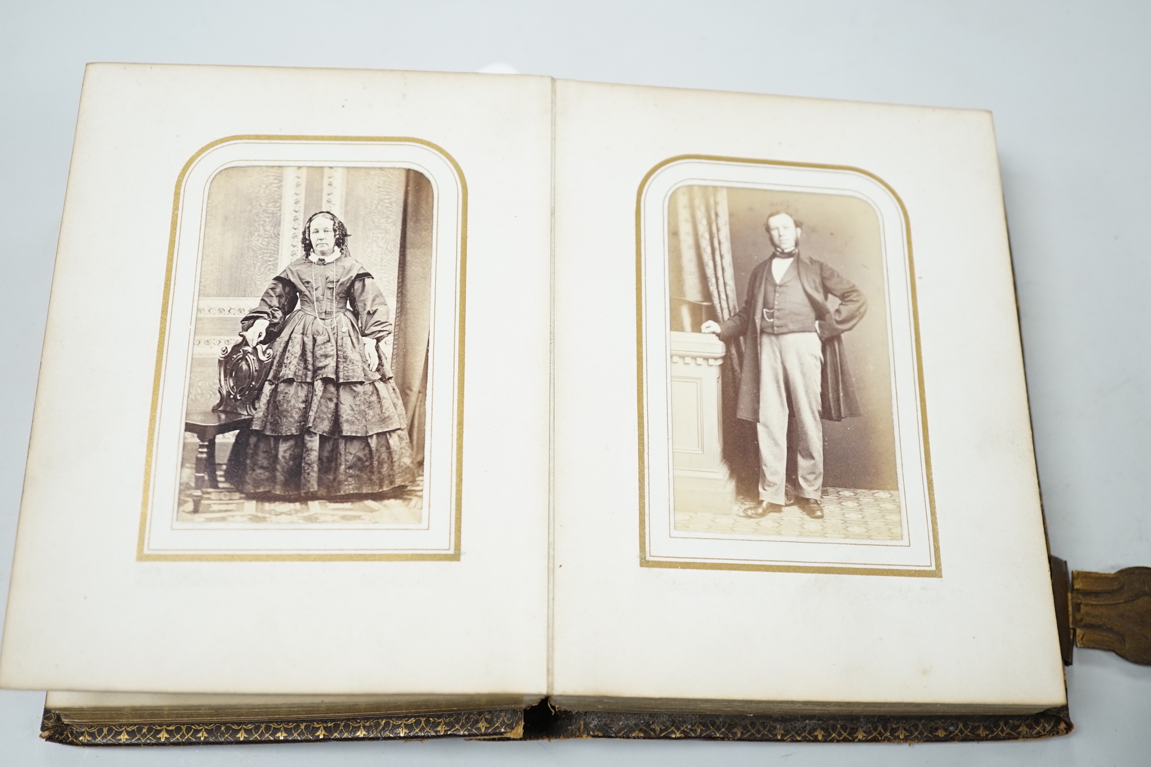 Two Victorian leather portrait photo albums, largest 16cm high, 12.5cm wide